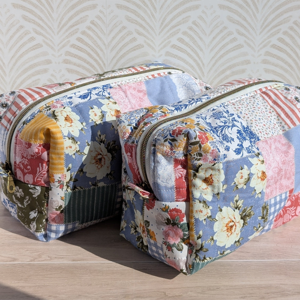 Floral patterned makeup bag on a wooden surface with a textured wall background